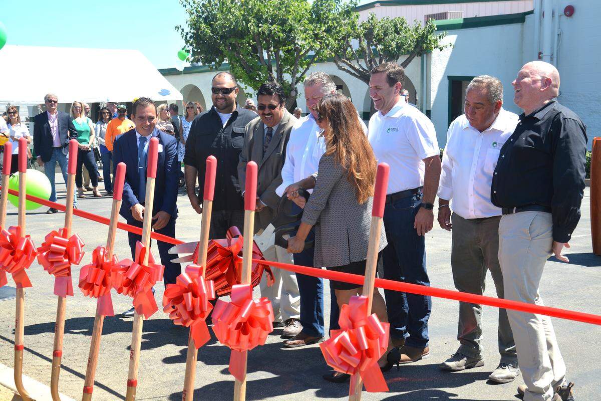 City of Livingston and Emerald Textile Services officials cut the ribbon during a groundbreaking ceremony of the business’s new automated medical laundry facility, Friday, July 12, 2019, at 420 Industrial Drive in Livingston, Merced County, California.