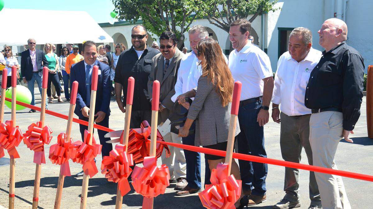 City of Livingston and Emerald Textile Services officials cut the ribbon during a groundbreaking ceremony of the business’s new automated medical laundry facility, Friday, July 12, 2019, at 420 Industrial Drive in Livingston, Merced County, California.