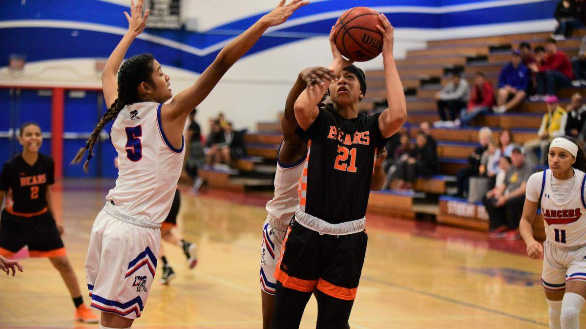 Merced High senior Khya Martin draws a foul as she goes up for a shot against East Union during a playoff game on Thursday, Feb. 20, 2020 at East Union High School in Manteca, Calif.