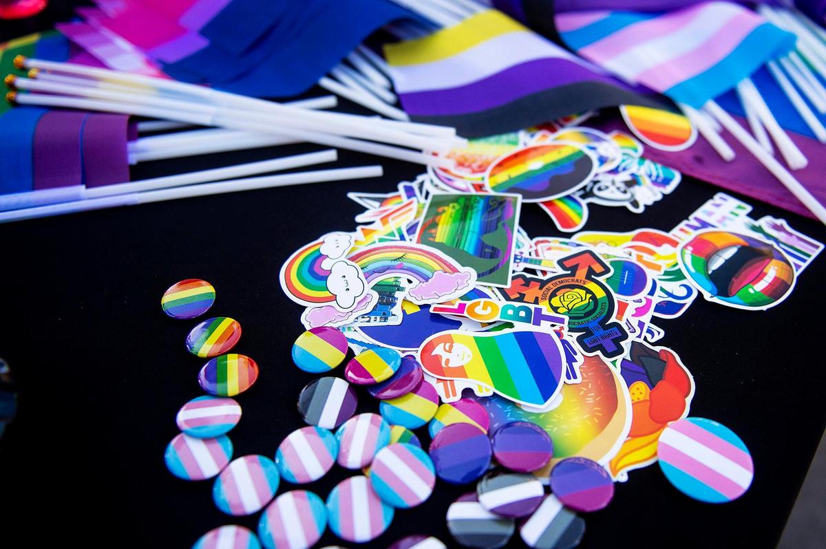 Pride swag is available for those in attendance during the Pride Progress flag raising ceremony at Bob Hart Square in Merced, Calif., on Wednesday, June 1, 2022. The Merced City Council approved the addition of the pride flag to the regular flag calendar, meaning the flag will fly over Bob Hart Square annually during the month of June.