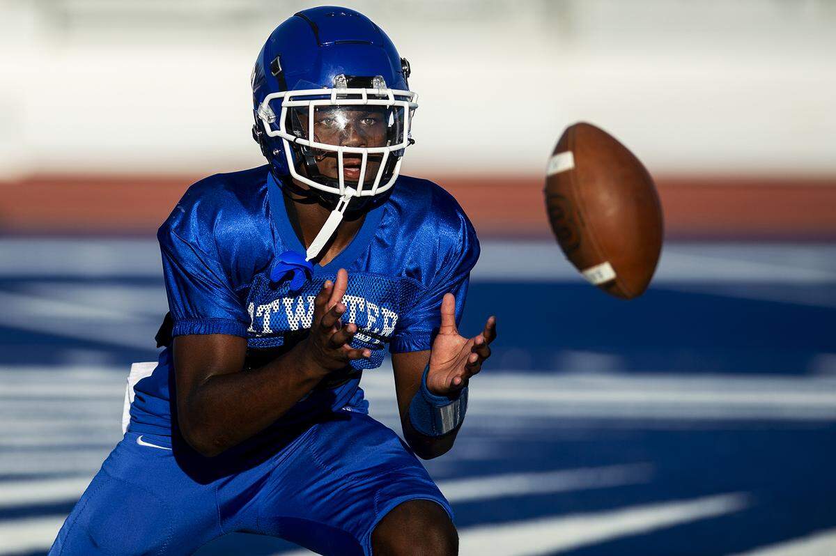 AJ Banks catches a pass during football practice at Atwater High School in Atwater, Calif., on Wednesday, Aug. 14, 2024.