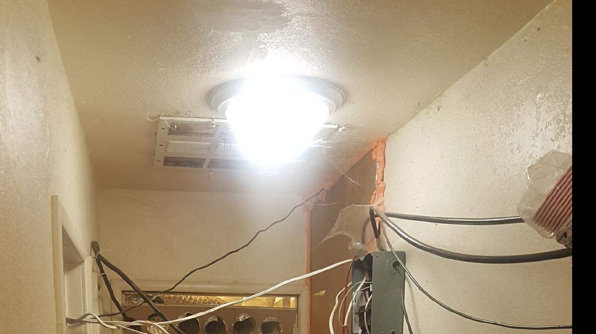 Merced County Sheriff's deputies work to process and dismantle an indoor marijuana operation on Sixth Street in South Dos Palos on Tuesday, Sept. 12, 2017.