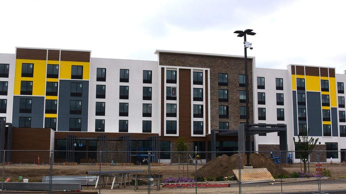 Construction crews work to complete the 133-room Hilton Garden Hotel located on Campus Parkway in Merced. Local developer Daniel Moradzadeh says the hotel is the start of a development that will include a shopping plaza in southeast Merced.