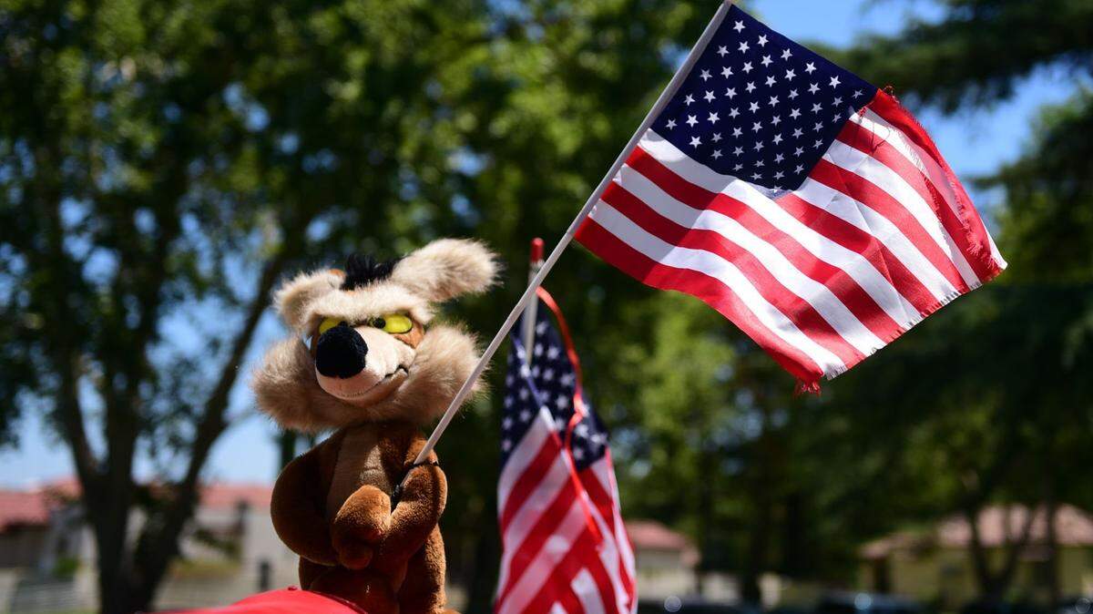A stuffed Wile E. Coyote holding a flag sits atop a buggy at the Atwater Fourth of July festival on Tuesday, July 4, 2017. This year, the city and residents planning an alternative to the annual festivities, due to the coronavirus pandemic.