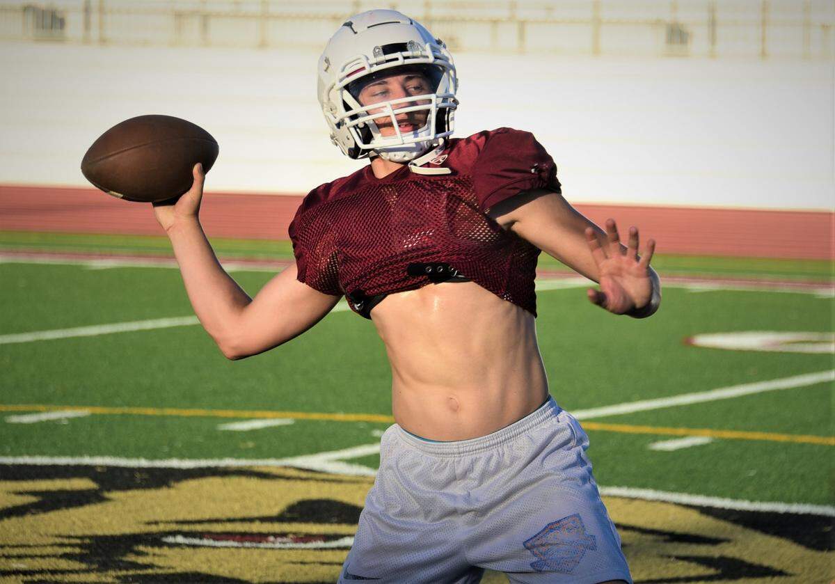 Golden Valley High School senior quarterback Austin Mello throws the ball during practice on Tuesday, Aug. 15, 2023 at Veteran Stadium in Merced, Calif.
