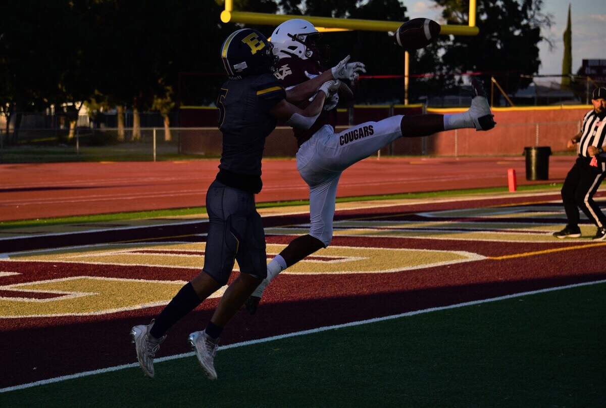 Golden Valley High School defensive back Tyrrell Johnson (7) breaks up a pass to Escalon receiver Sam Jimenez (5) in the first quarter during a game on Friday, Aug. 18, 2023 at Veterans Stadium in Merced, Calif.