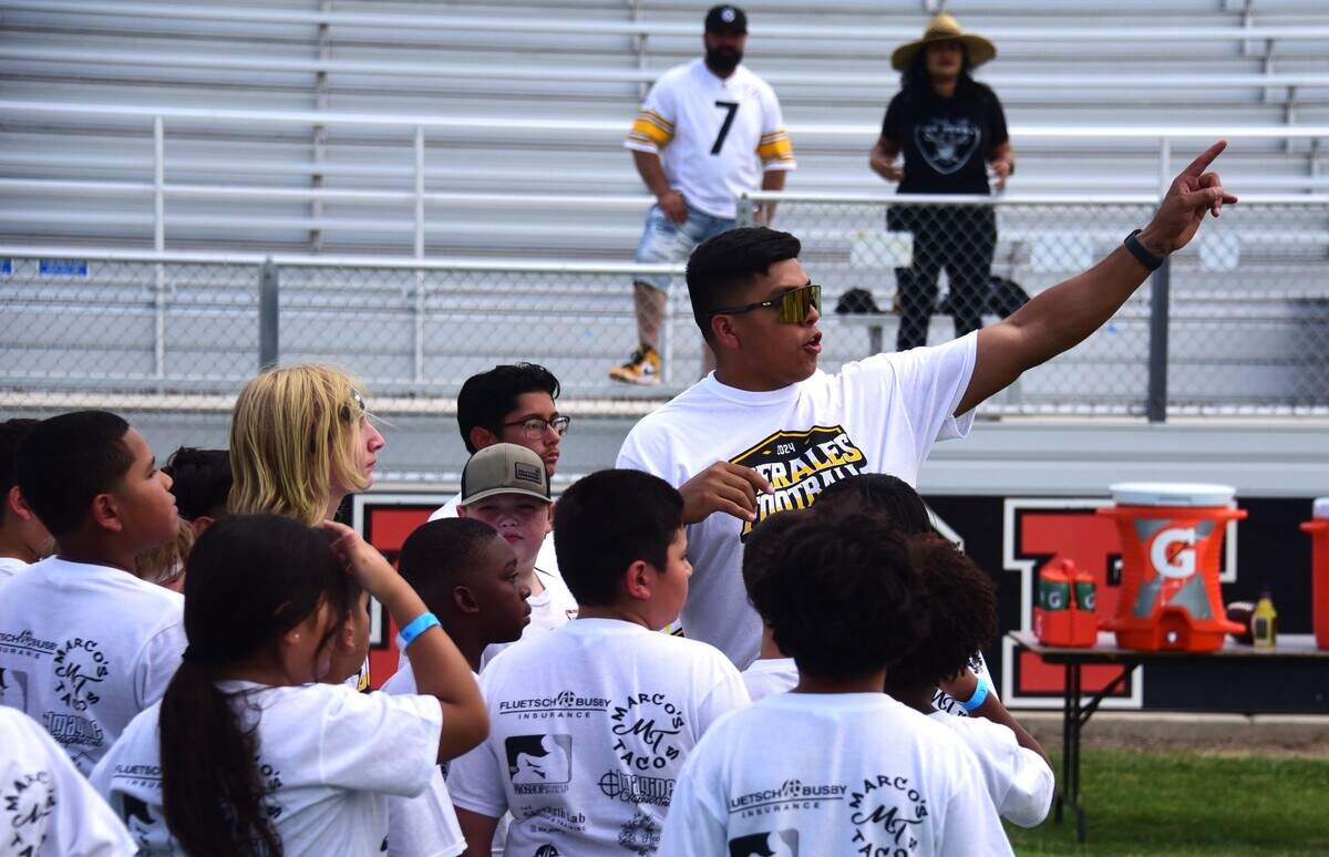 Pittsburgh Steelers linebacker David Perales instructs the kids where to go next during the David Perales Football Camp held at Merced High School on Saturday, July 13, 2024 in Merced, Calif.