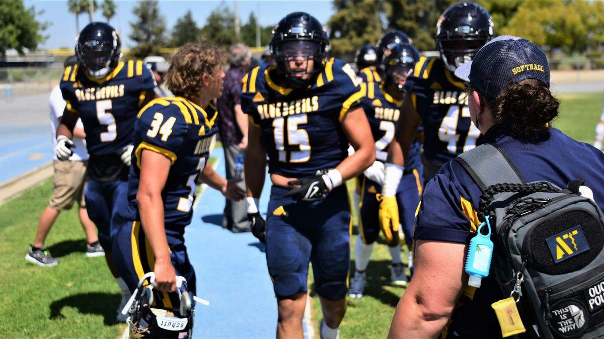 Merced College linebacker Nate Ruiz (15) returns to the sideline after intercepting a pass in the first quarter against College of the Redwoods on Saturday, Sept. 3, 2022.