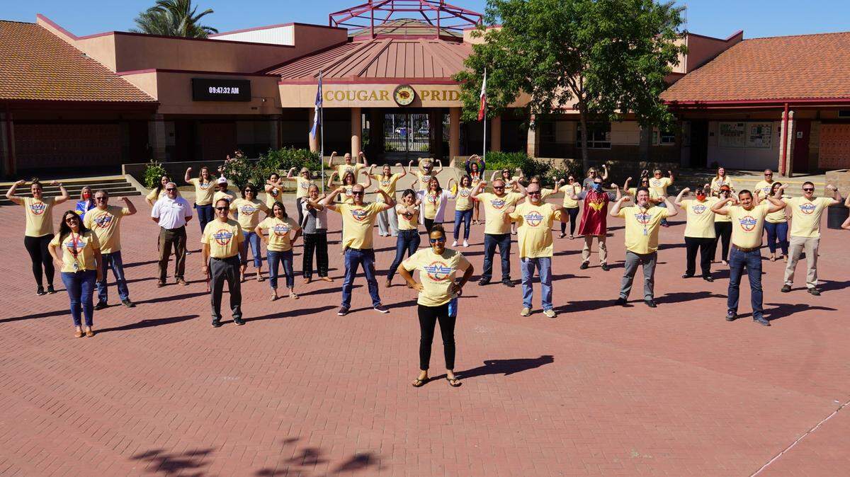 Megan Cope, a Golden Valley High associate principal, center, is shown with staff and supporters wearing Team Cope shirts. Cope was diagnosed with a rare liver disease.