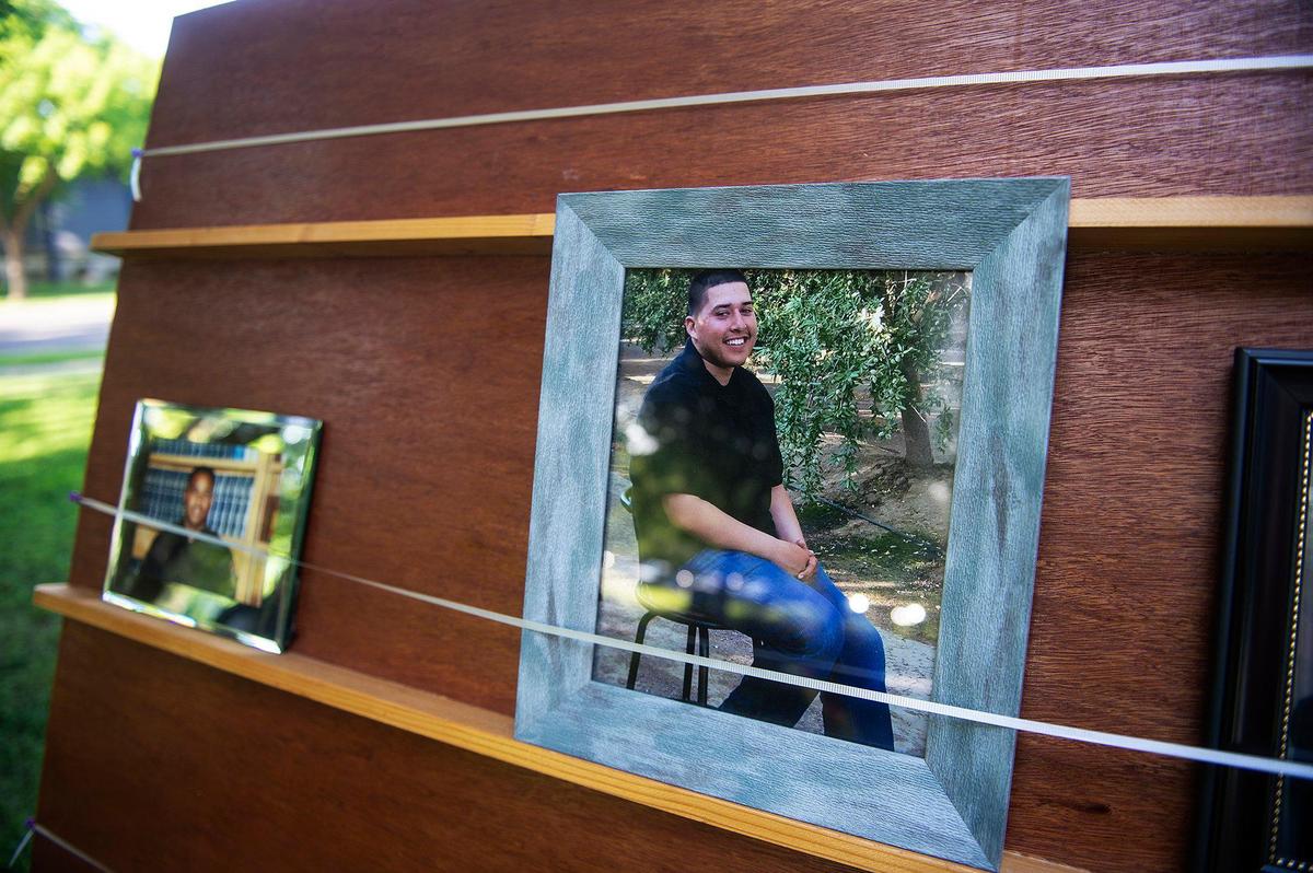 A photo of Diego Gallardo who was shot and killed in Planada in Feb. 2018, is displayed along with other victims of violence during the annual Victims’ Rights Ceremony at Courthouse Park in Merced, Calif., on Tuesday, April 26, 2022.