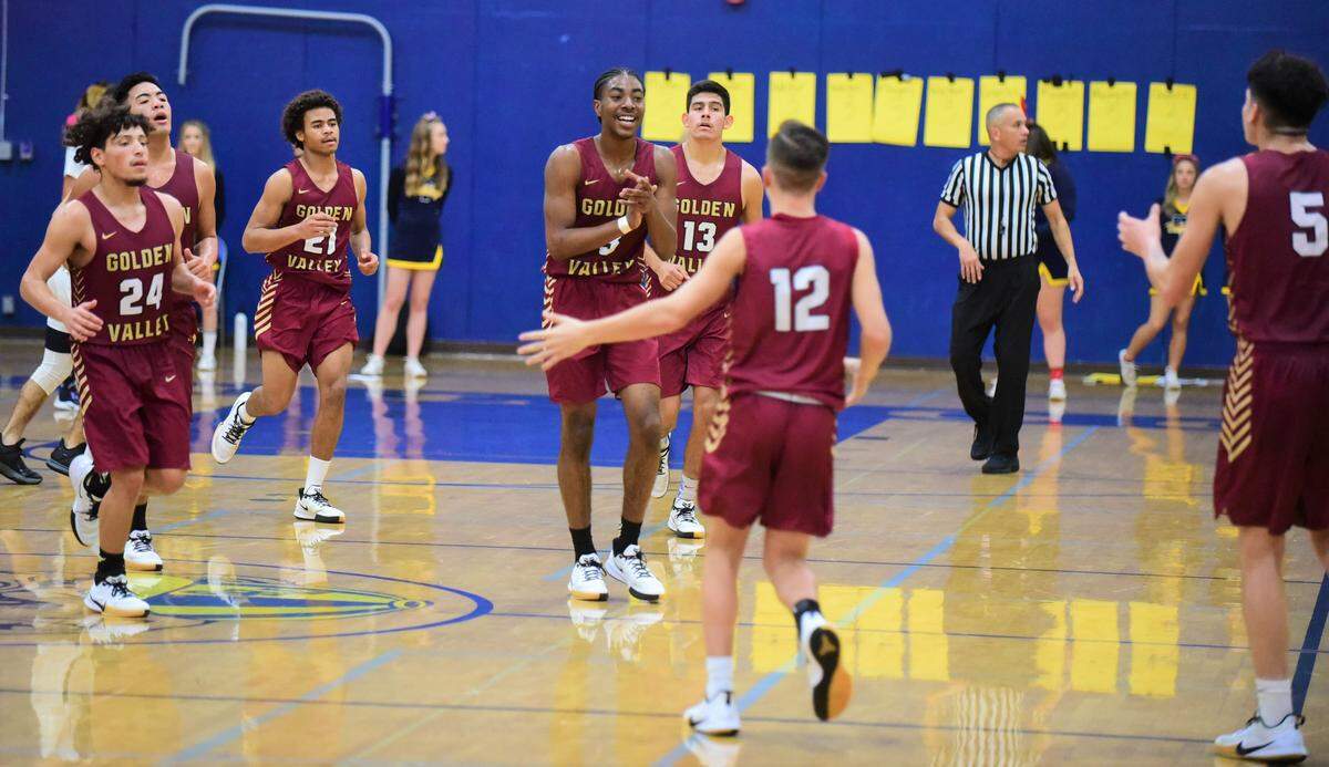 Golden Valley celebrates their 52-36 win over Turlock in the championship game of the Godinez Tournament at Turlock High School on Friday, Dec. 14, 2019.
