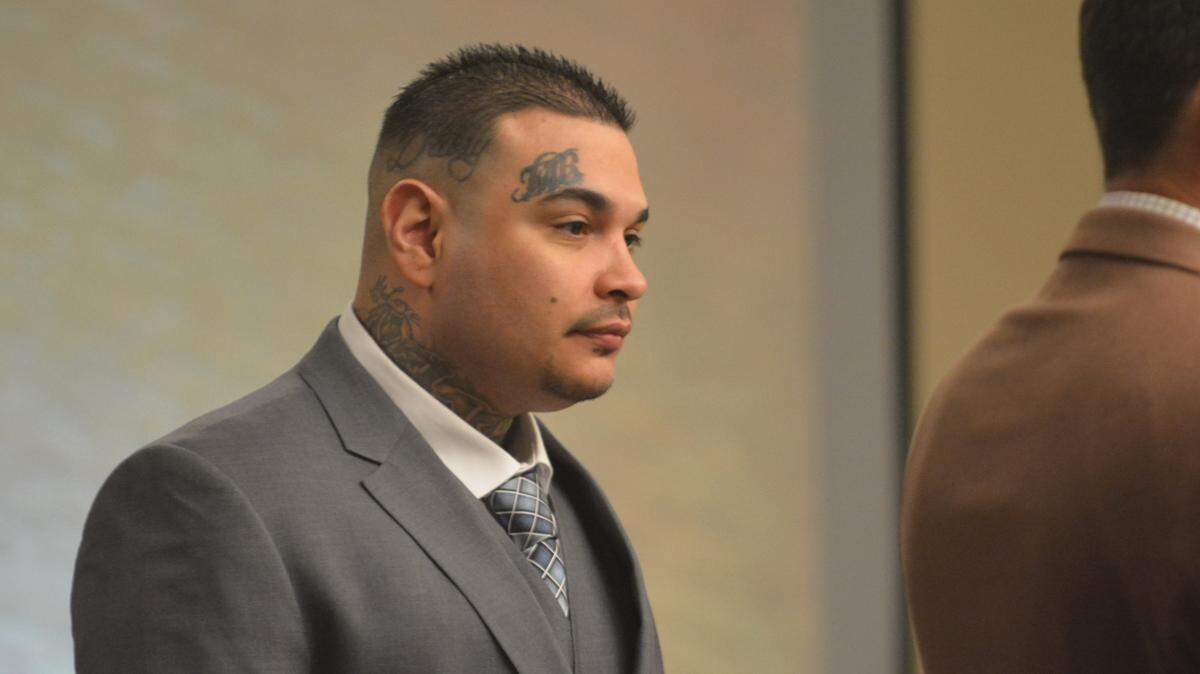 Pete Valenzuela Jr., 32, stands up during his triple homicide trial hearing Tuesday, Oct. 30, 2018, in Merced County Superior Court.
