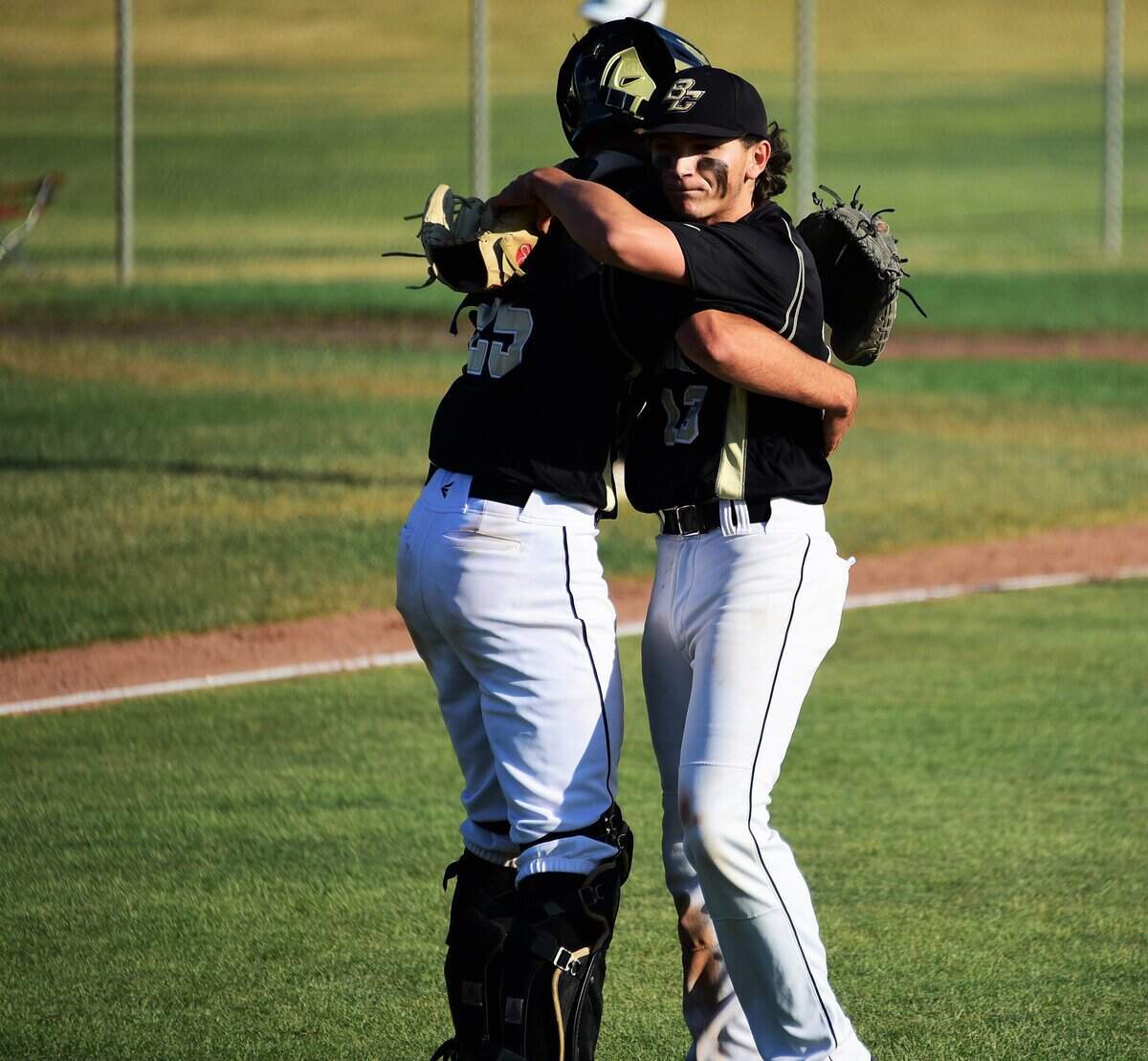 Buhach Colon’s Antonio Cortez and catcher R.J. Garcia embrace after the Thunder’s 6-2 win over Rio Americano on Friday, May 17, 2019.
