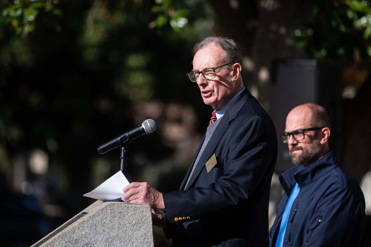 Merced County Historical Society President Chris Tomford speaks to the crowd during a ceremony to celebrate the start of a project to restore the exterior of the historic Merced County Courthouse Museum in Merced, Calif., on Wednesday, Dec. 11, 2024. More than $3 million in funding was secured for the restoration process which will help to maintain the building’s structural integrity and long-term sustainability. County officials said a time capsule containing various items will be buried on the property upon completion of the restoration project.