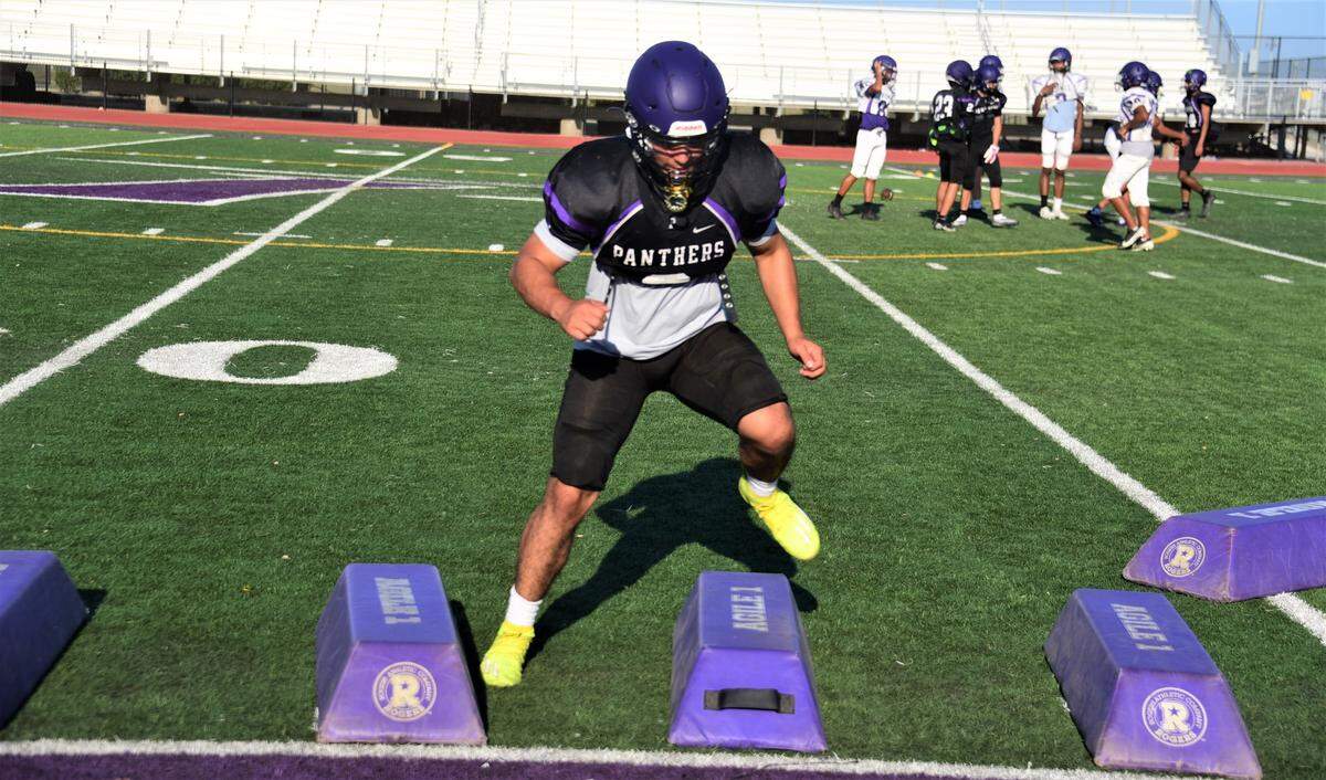 Pacheco High School senior linebacker Brandon De Reza goes through drills during practice on Wednesday, Aug. 3, 2022 at Pacheco High School in Los Banos, Calif.