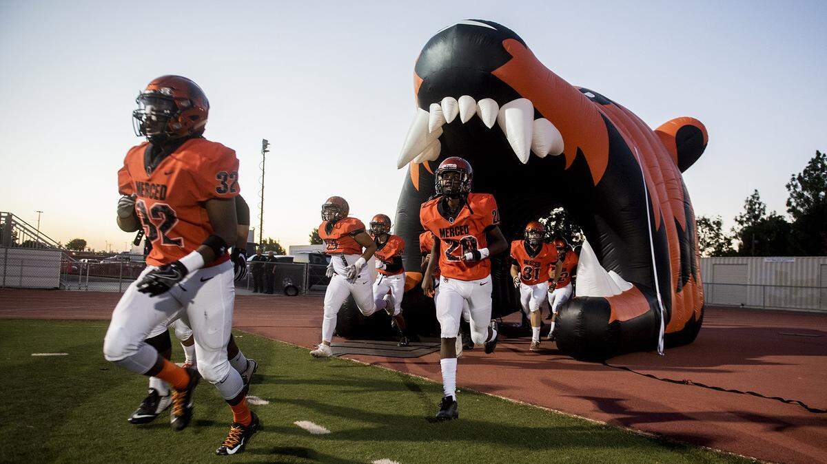 The Merced Bears take the field during a game against Madera at Veterans Stadium on the campus of Golden Valley High School in Merced, Calif., on Friday, Sept. 7, 2018. The Bears beat the Coyotes 63-35. 