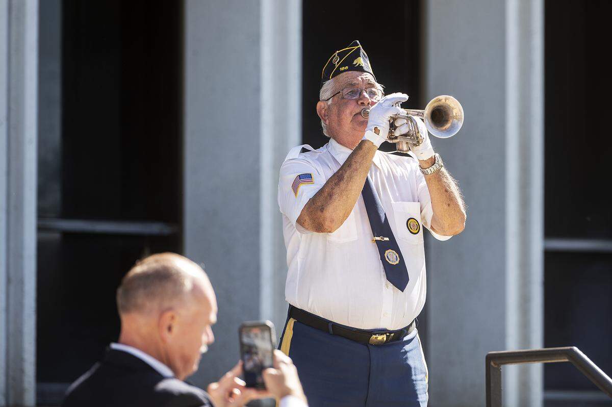 Los Banos resident and United States Navy veteran Rick Toscano, 74, performs Taps during the annual Merced County Peace Officers Memorial Ceremony in Merced, Calif., on Wednesday, May 29, 2024. The ceremony honors law enforcement officers who died in the line of duty.