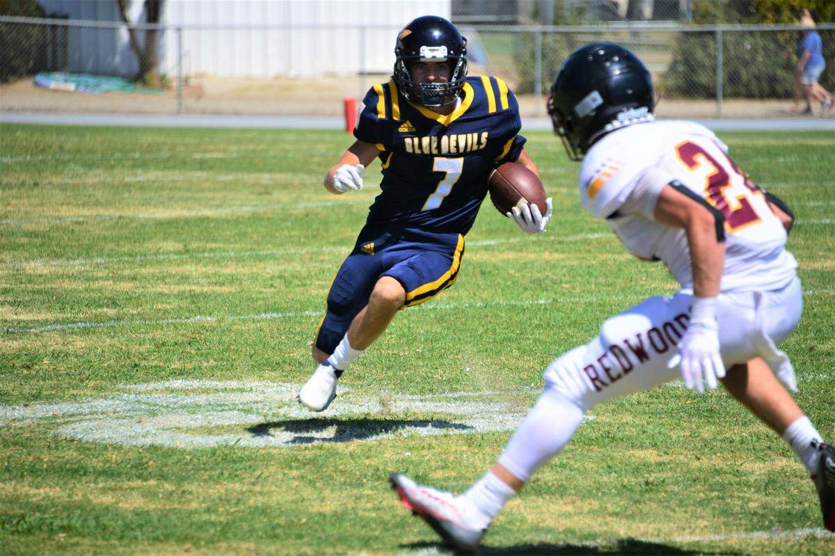 Merced College receiver Jayden Vargas runs the ball against College of the Redwoods on Saturday, Sept. 3, 2022. The Blue Devils won 27-19.
