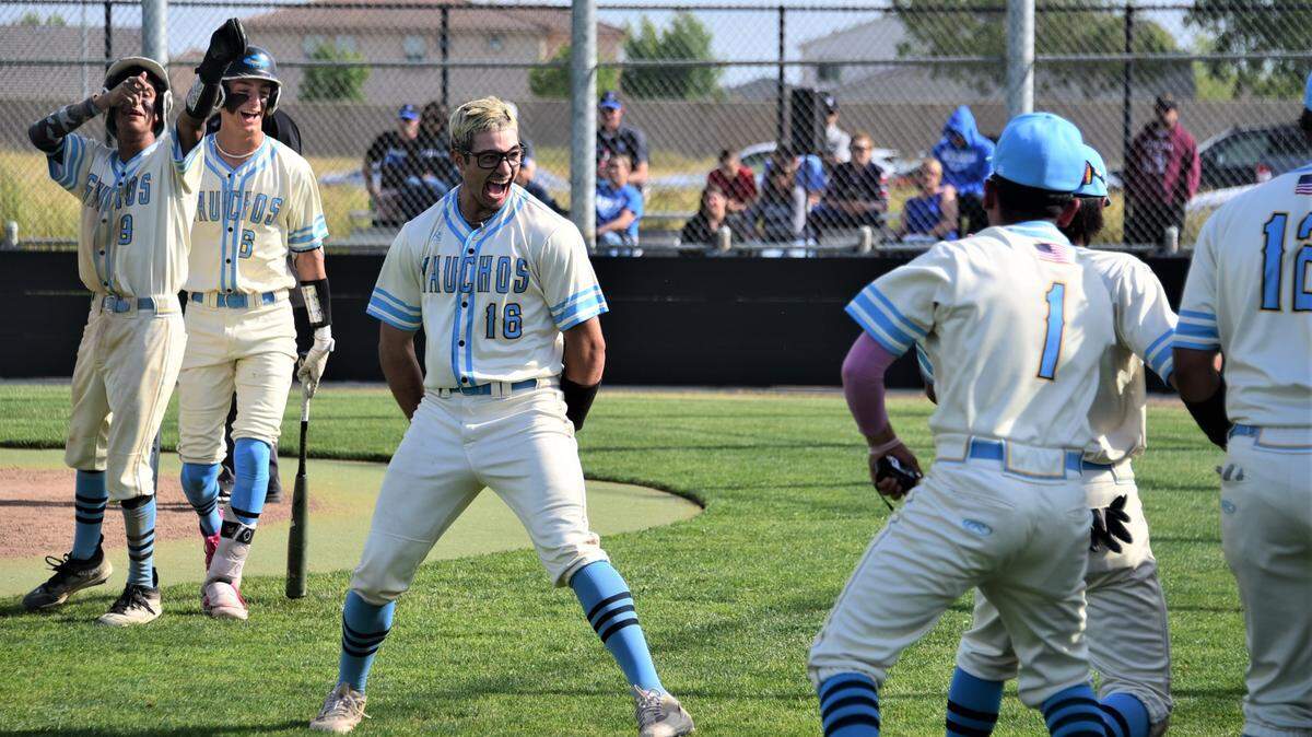 El Capitan High School junior Juan Munoz (16) celebrates with teammates after hitting a two-run homer in the second inning during a playoff game against Bear Creek on Tuesday, May 9, 2023 at El Capitan High School.