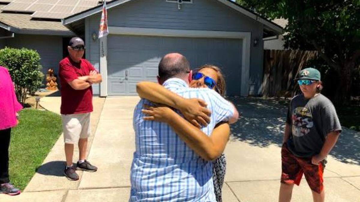Megan Cope hugs friend Matt Thomas before heading off Sunday to St. Louis, Missouri, where she awaits a liver transplant.
