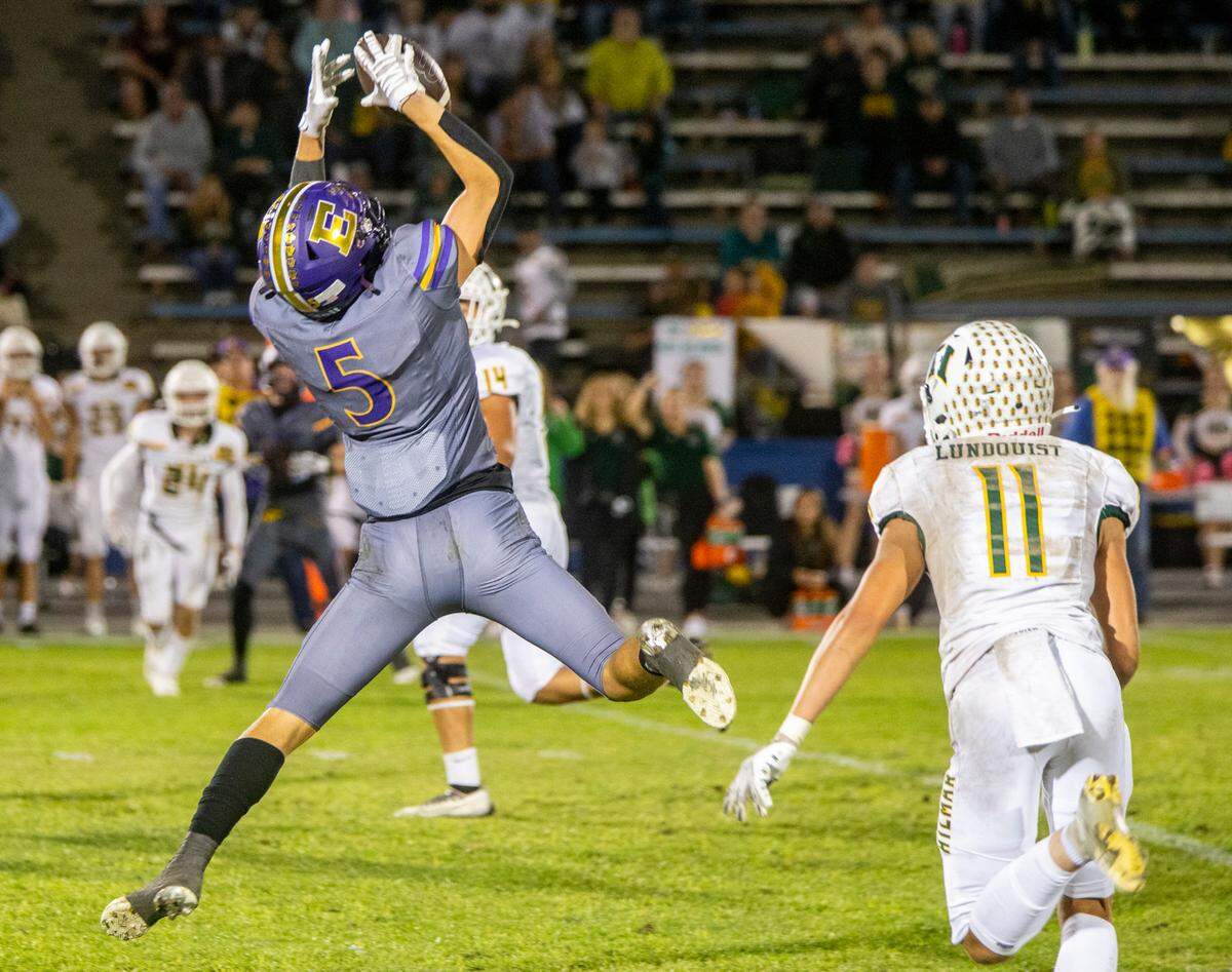 Sam Jimenez, 5, of Escalon High reaches up for a pass as Hilmar High closes in Friday Oct. 13, 2023 night.
