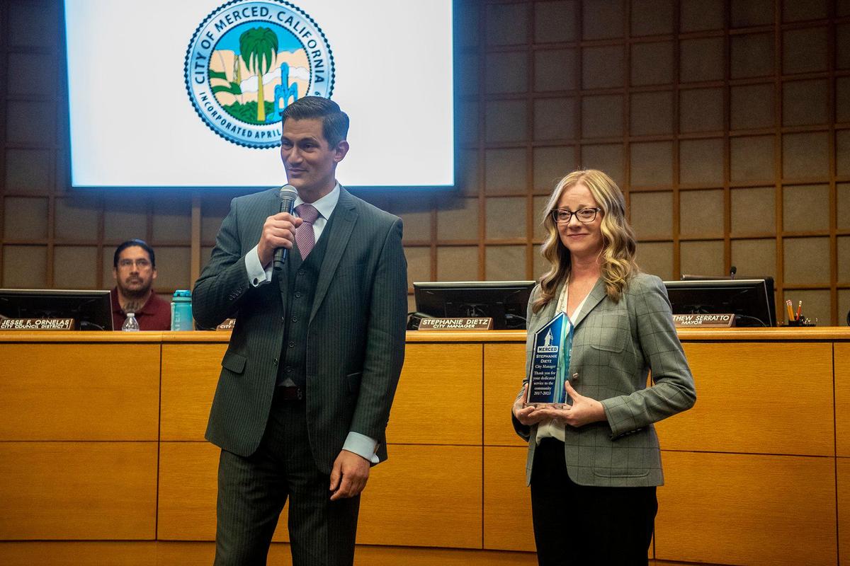 Merced Mayor Matthew Serratto, left, thanks outgoing City Manager Stephanie Dietz for her service and commitment to the city during a ceremony at the Merced City Council meeting in Merced, Calif., on Monday, Nov. 6, 2023.