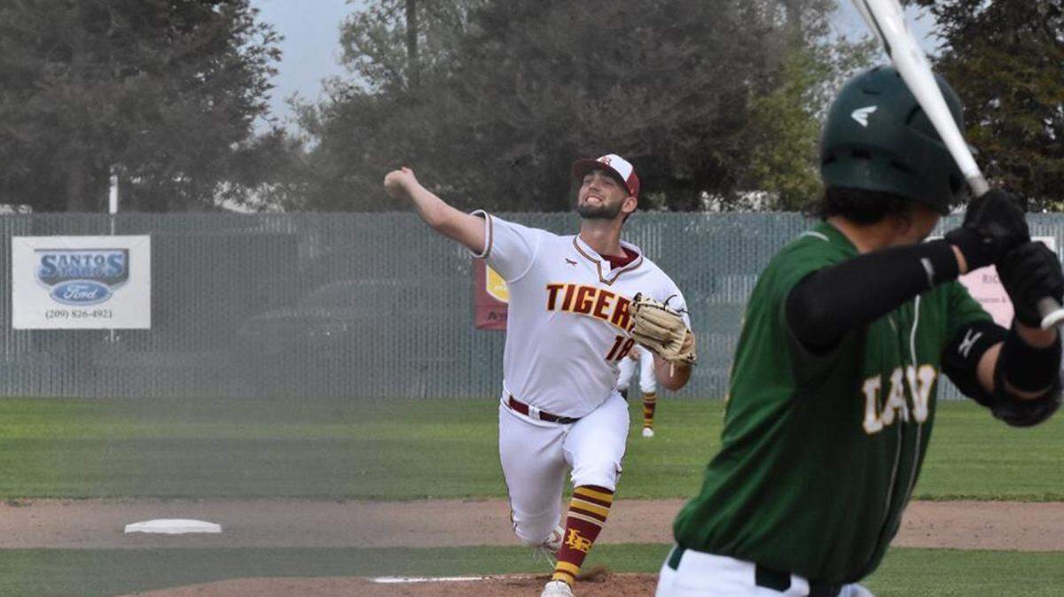 Los Banos High senior Kody Cardoza delivers a pitch against a Grace Davis hitter on March 27, 2019. Cardoza has been a four-year varsity starter for the Tigers.