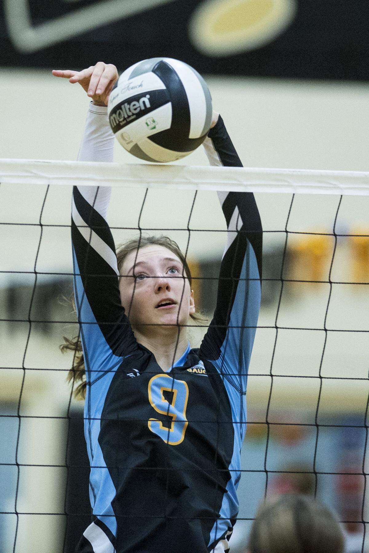 El Capitan junior Robin Helms (9) tips the ball over the net during a match against Buhach Colony earlier this season. Helms signed her national letter of intent to accept a volleyball scholarship to the University of Hartford on Thursday at El Capitan High.