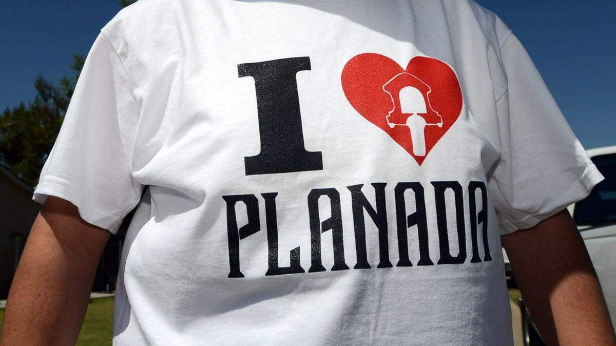 Ruben Perez, 32, of Planada shows his community pride during the Planada Community Day parade Saturday, May 10, 2014, in Planada. The 80-year-old event celebrates the people and the community with live music, food and fellowship.