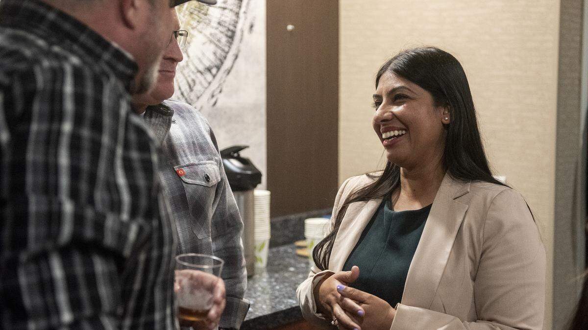 Merced County Superior Court Judge candidate Monika Saini-Donabed, right, speaks with supporters as Primary Election results are released in Merced, Calif., on Tuesday, March 5, 2024.