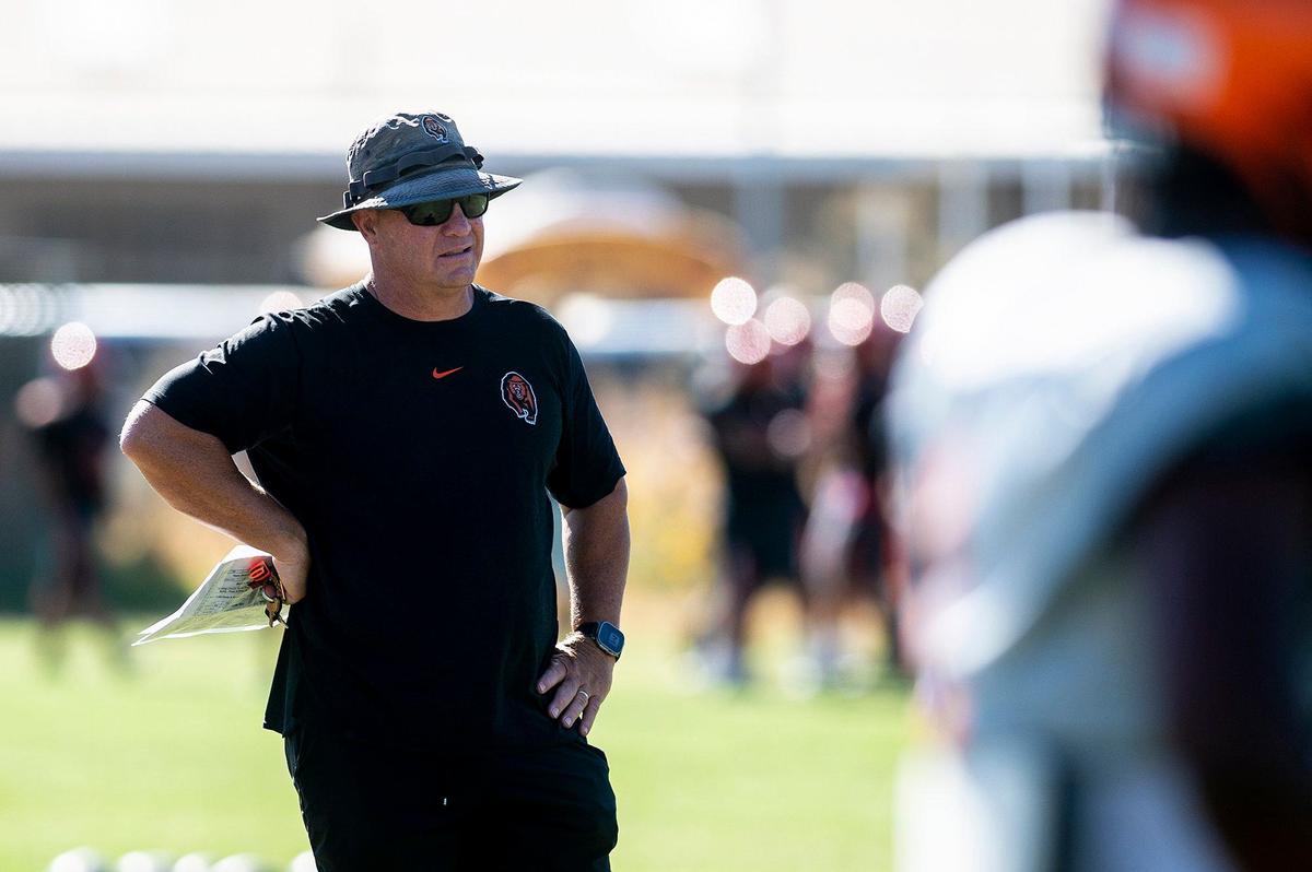 Merced High School football coach Rob Scheidt looks on during practice at Merced High School in Merced, Calif., on Monday, Aug. 19, 2024.