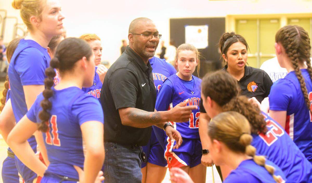 Atwater High School girls basketball coach JR Davis talks to his team during a timeout during a game against El Capitan on Tuesday, Jan. 16, 2024.