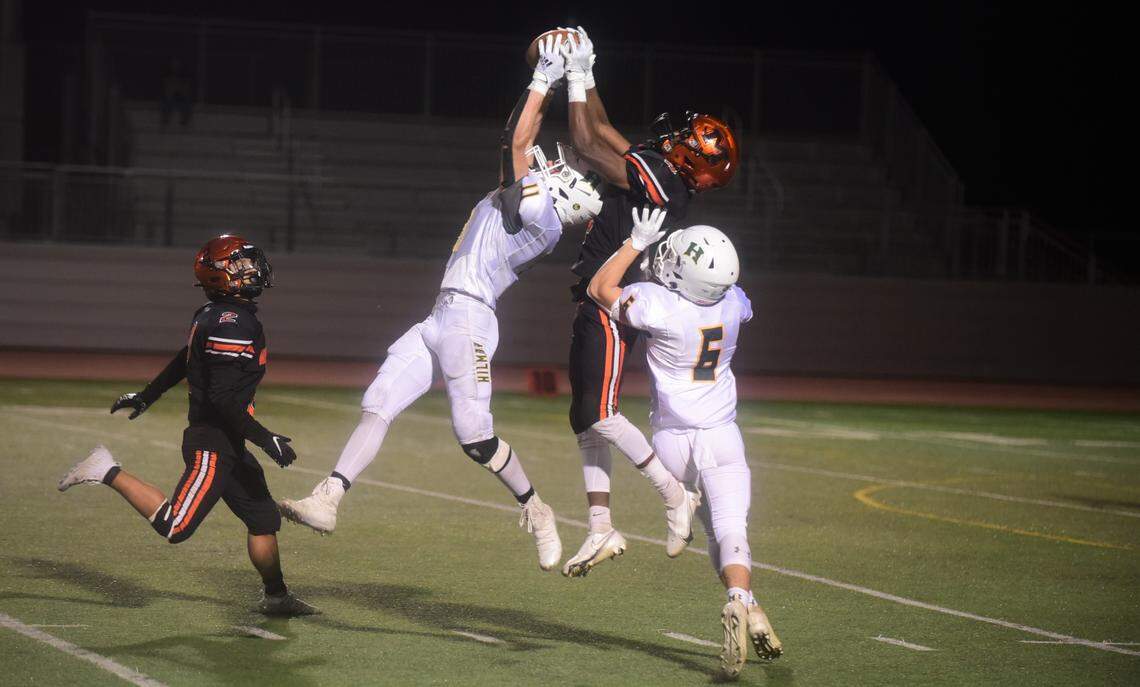 Hilmar safety Cannon Irelan comes up with an interception over Merced receiver Raheem Choyce during the Bears’ 14-13 win on Friday, April 2, 2021 at Veteran Stadium in Merced, Calif.