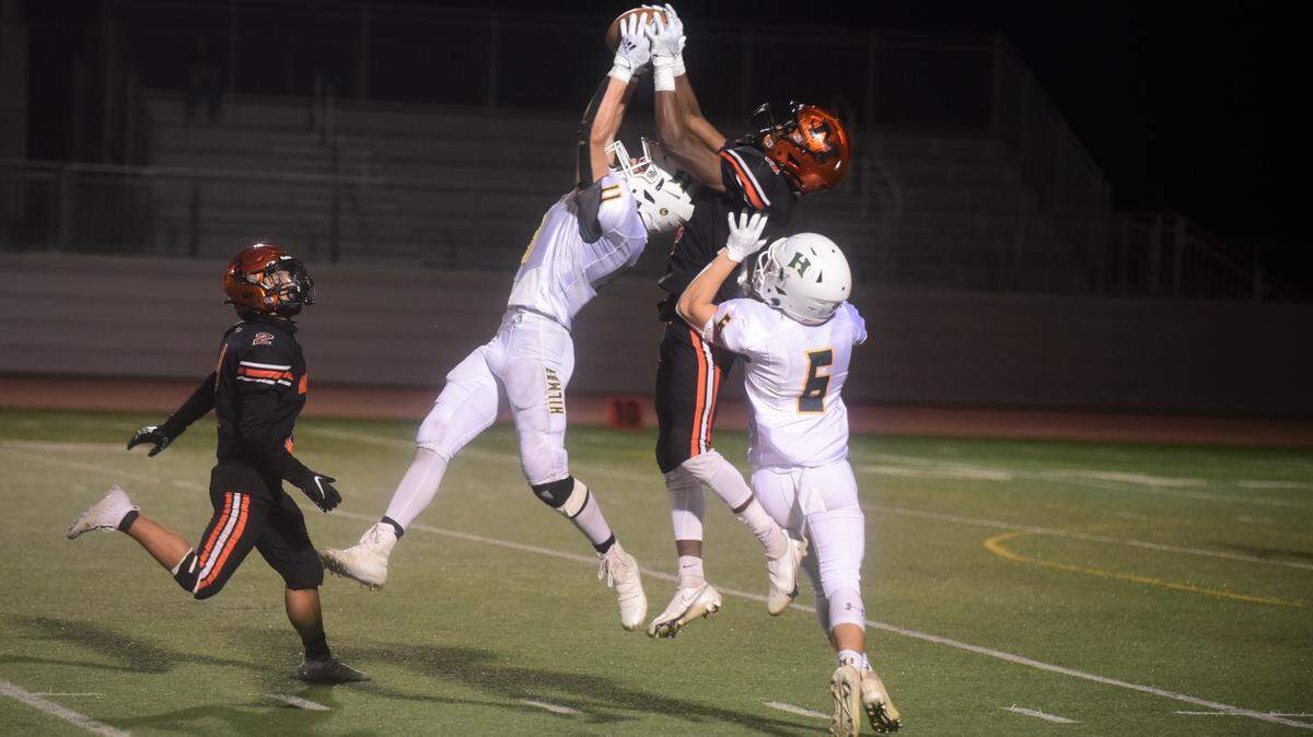 Hilmar safety Cannon Irelan comes up with an interception over Merced receiver Raheem Choyce during the Bears’ 14-13 win on Friday, April 2, 2021 at Veteran Stadium in Merced, Calif.