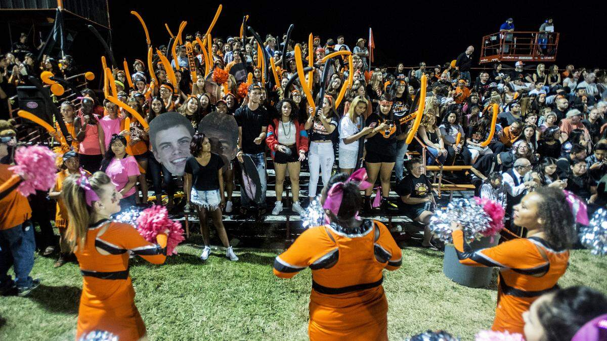 The Merced student section cheers during a game against Atwater at Merced High School in Merced, Calif., Friday, Oct. 9, 2015. The Bears beat the Falcons 39-14.