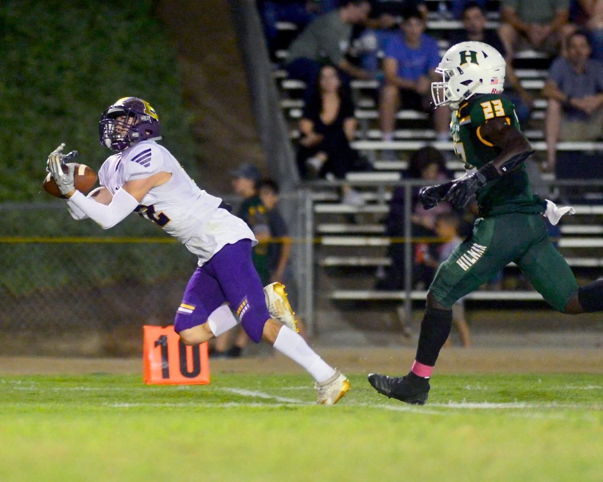 Escalon receiver Kaidence Trejo (12) makes a catch downfield during a game between Hilmar High School and Escalon High School at Hilmar High School in Hilmar California on September 20, 2019.