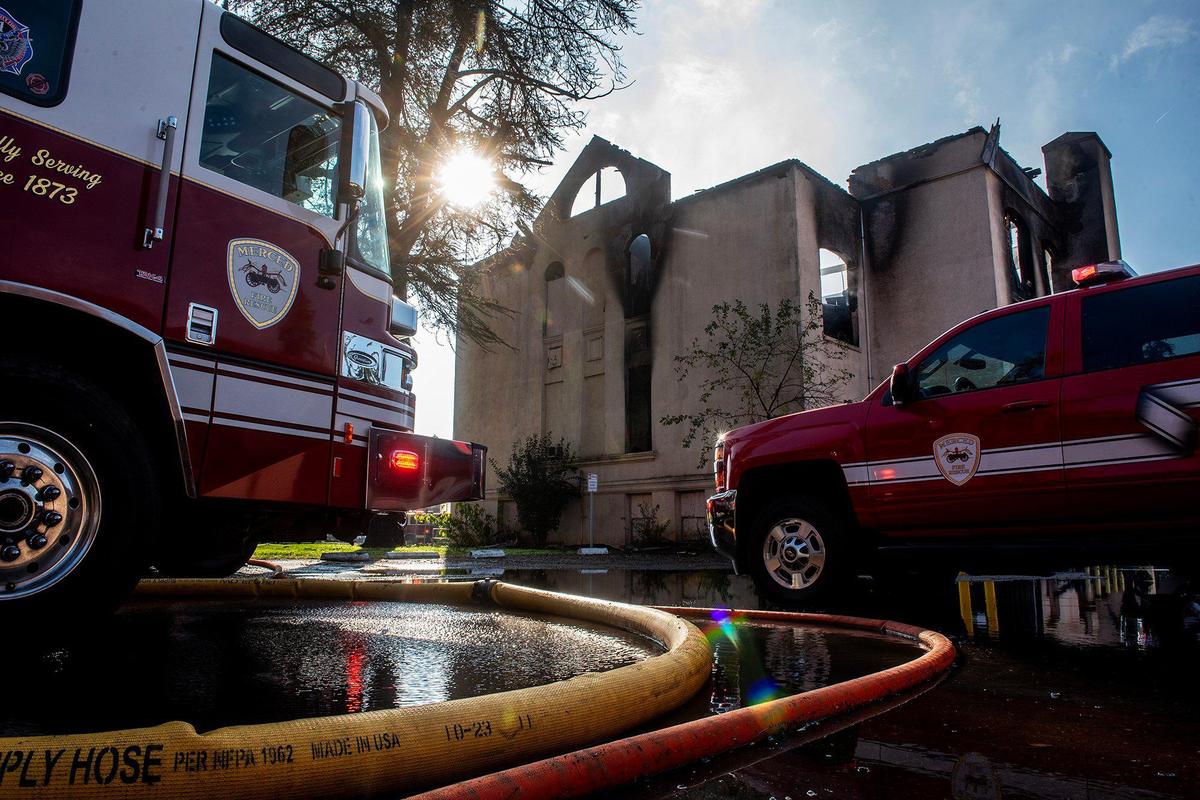 City and county fire crews respond to a structure fire at the historic Merced County High School building located at 2125 M Street in Merced, Calif., on Monday, Dec. 2, 2024. Fire officials said the cause of the fire is under investigation.