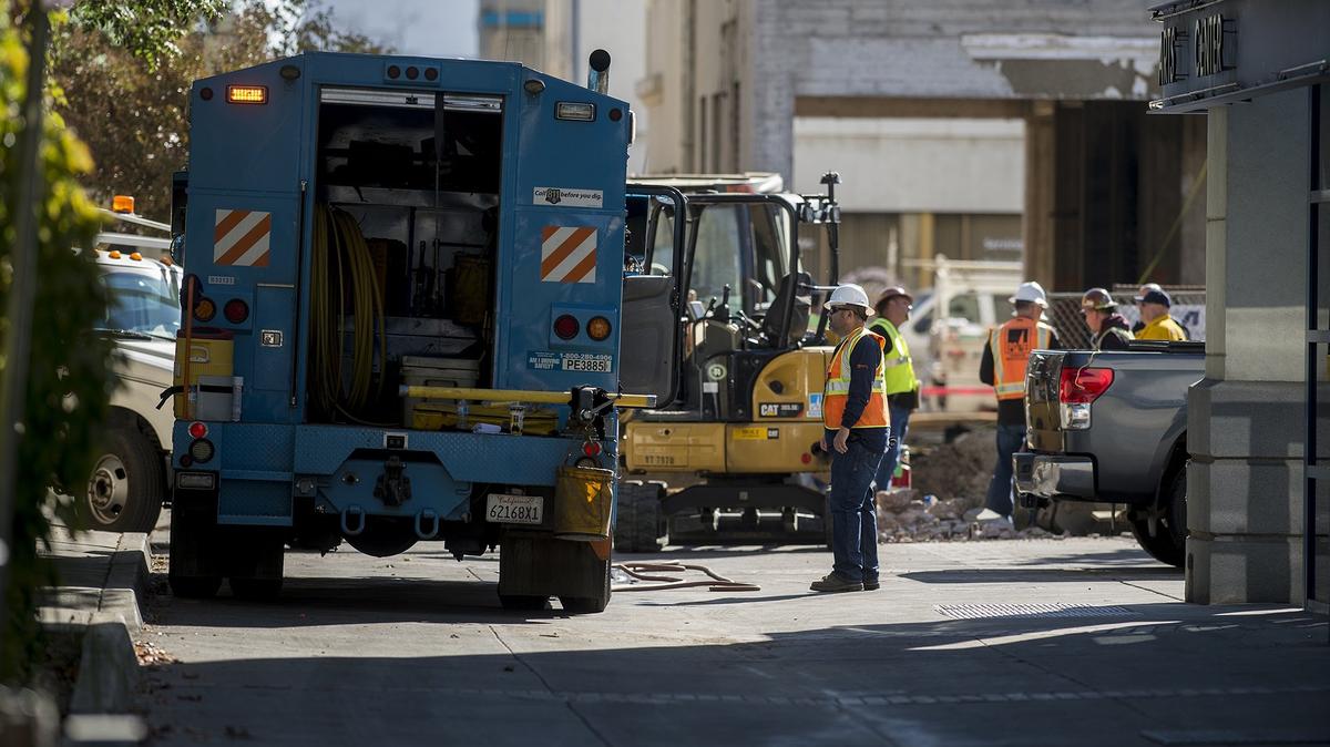 Pacific Gas and Electric Company crews work in an alleyway after a gas main break in Merced, Calif., on Monday, Oct. 22, 2018. According to Merced City Fire Department Chief Mike Wilkinson, a gas main was broken by construction crews working in the area of the El Capitan Hotel. One city block was evacuated between M Street and N Street as crews worked to fix the leak. At about 10:30 a.m., fire officials said the gas line was secured and declared it safe for people to return to area businesses.