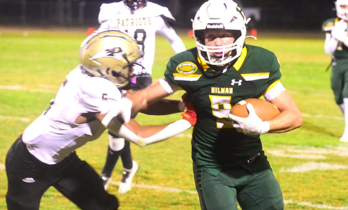 Hilmar High School junior Caden Bailey (9) runs the ball during a playoff game against Pioneer on Thursday, Nov. 9, 2023.