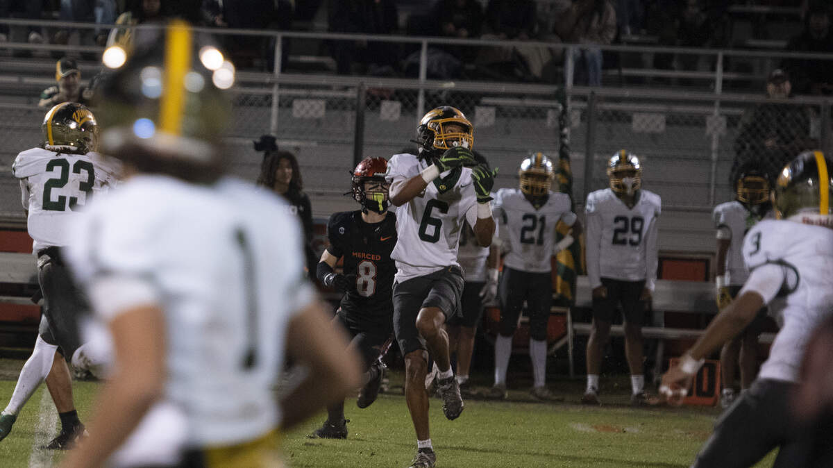 Vanden senior captain Caleb Jones returns an interception in the first quarter against Merced during a Sac-Joaquin Section Division III playoff game on Friday, Nov. 14, 2025, at Cathie Hostetler Stadium in Merced. Jones added a fumble return for a touchdown in the Vikings’ 26-25 win.
