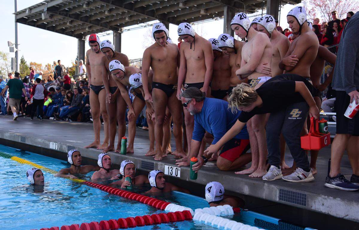 Buhach Colony water polo coach Dan McIlhatton talks to his team during a timeout during the Sac-Joaquin Section Division III championship game.