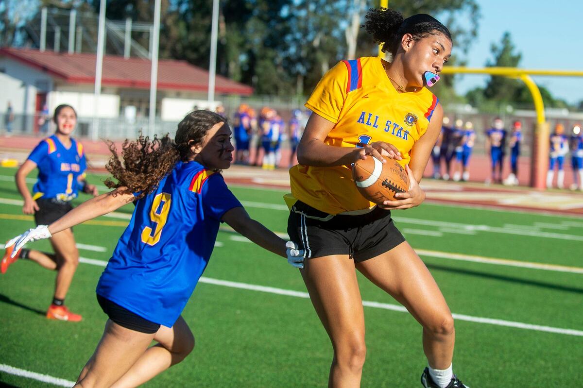 Gold All-Star Averie Steverson (10) representing Merced, catches a pass during the Merced County All-Star Girls Flag Football Game at Golden Valley High School in Merced, Calif., on Saturday, June 15, 2024. The Blue All-Stars beat the Gold All-Stars 20-12.
