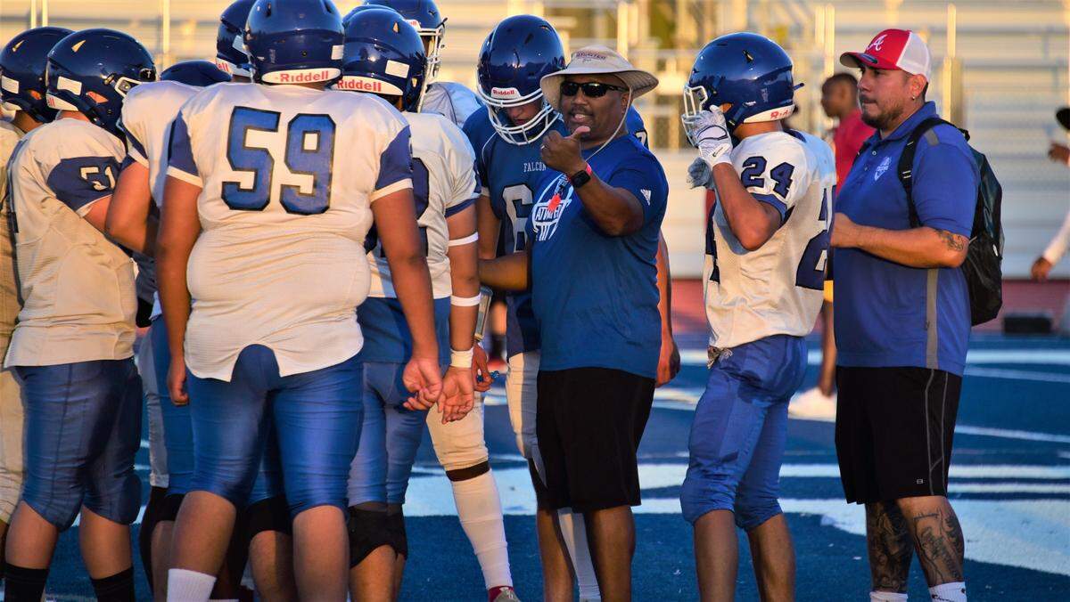 Atwater High School head coach Seneca Ybarra talks to his offense during a scrimmage against Edison of Stockton on Friday, Aug. 11, 2023 at Dave Honey Stadium in Atwater, Calif.