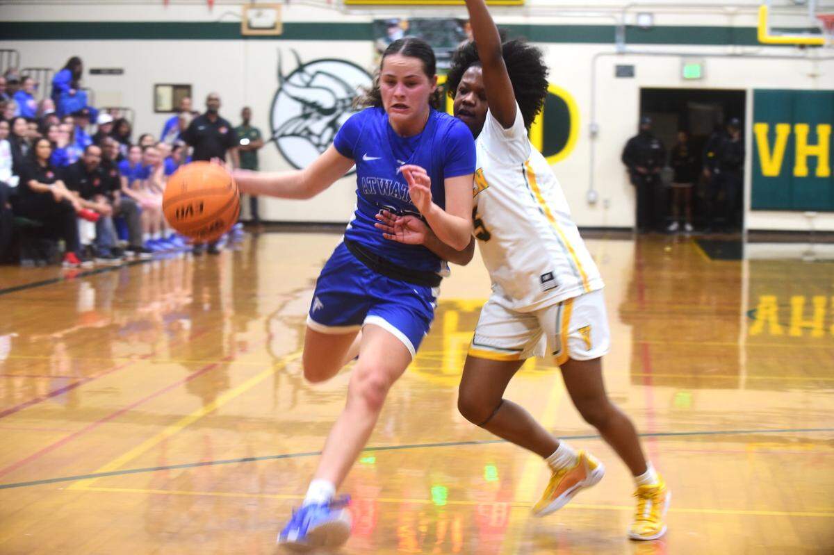 Atwater High School junior Karissas Hukill (25) dribbles the ball against Vanden during a playoff game on Monday, Feb. 19, 2024.