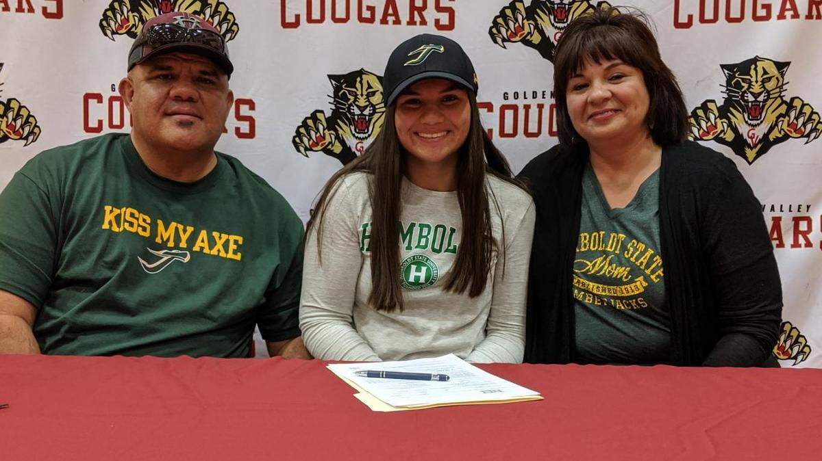 Golden Valley senior Vanessa Saltos, center, poses for a picture with her father Robert and mother Malissa during her signing ceremony at Golden Valley High School on Thursday. Saltos is headed to Humboldt State to play softball.