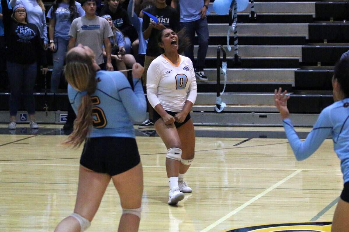 El Capitan’s Valeria Torres (0) and Natalie Collins (5) celebrate a point by the Gauchos during their volleyball match against Buhach Colony on Monday night at El Capitan High.