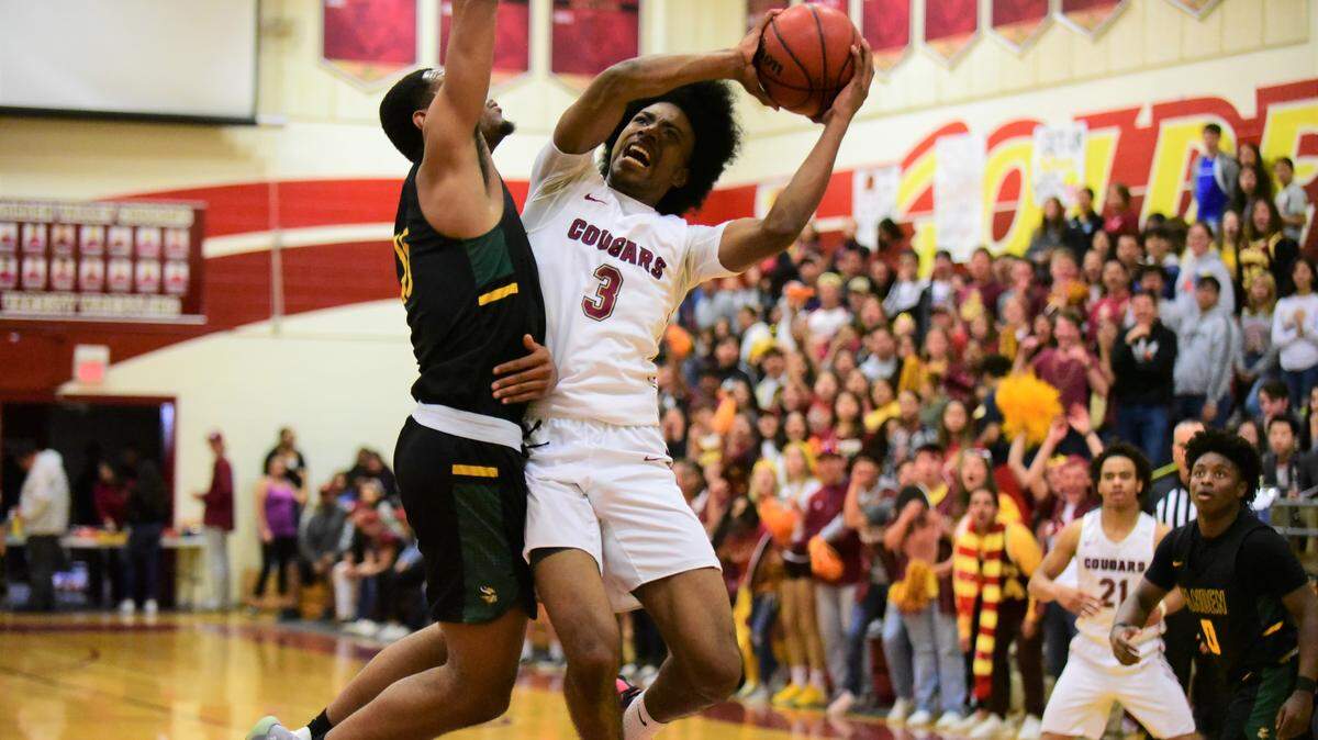 Golden Valley senior Aurrion Harris goes up for a shot against Vanden’s Teiano Hardee during the Sac-Joaquin Section Division III semifinal game against Vanden at Cougar Arena on Tuesday, Feb. 25, 2020.
