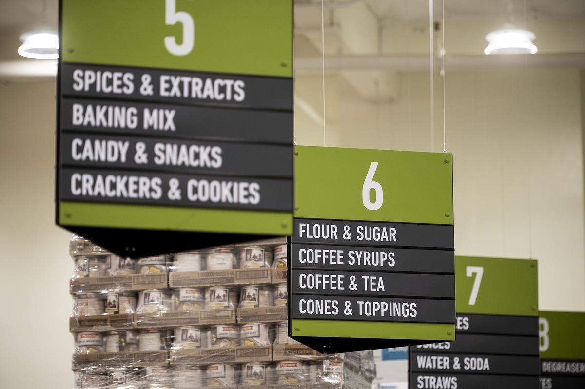 Sings indicate items located in aisles at the US Foods CHEF’STORE located at 3275 R Street in Merced, Calif., on Thursday, Jan. 5, 2023.