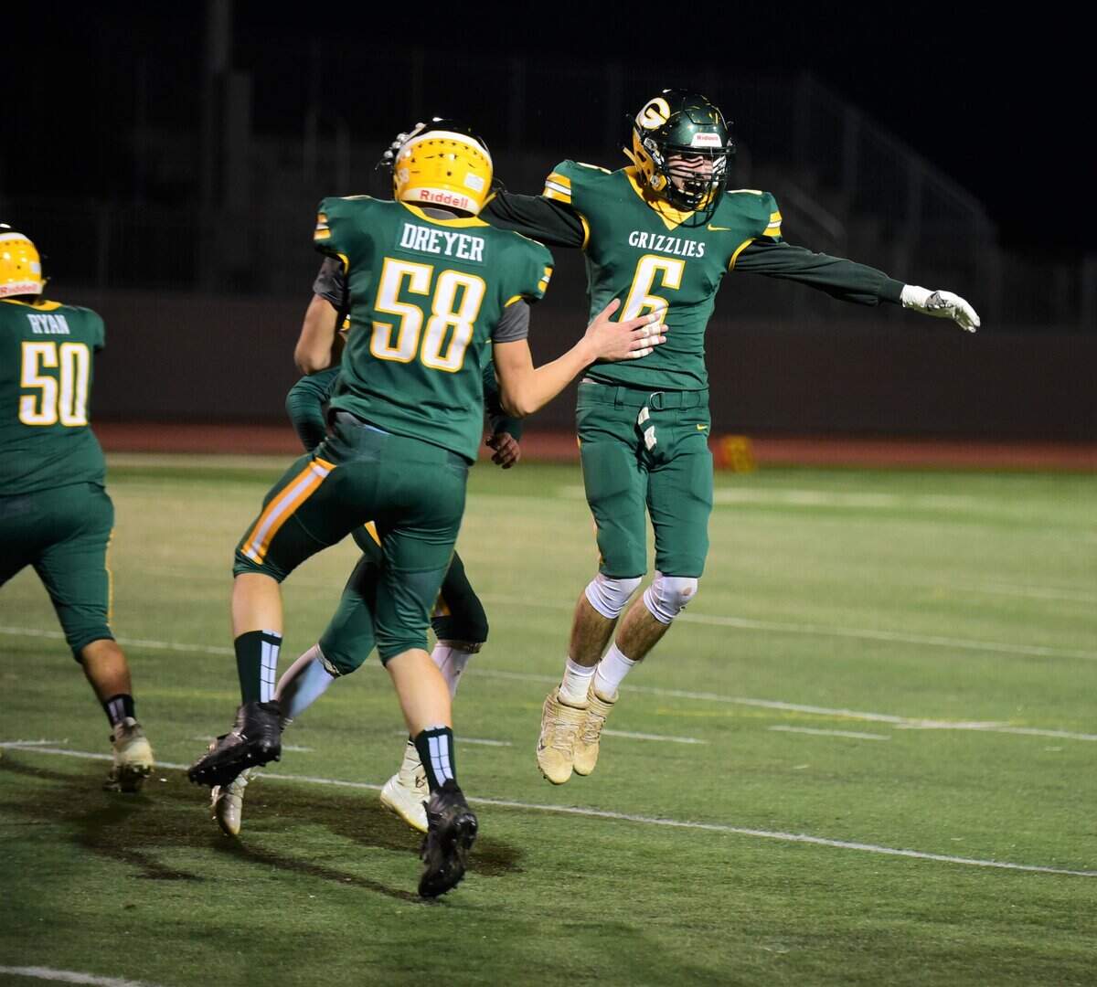 Mariposa senior Jake Swift (6) celebrates with teammate Hunter Dreyer (58) after Swift recovered a fumble against Lincoln on Friday, Dec. 6, 2019 at Veterans Stadium.