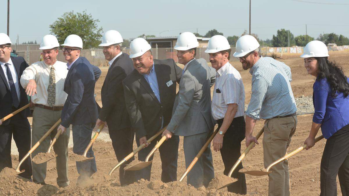 Local, county and state officials break ground Thursday, July 26, 2018, at the Campus Parkway and East Childs Avenue intersection during a ceremony for the $30 million second phase of the Campus Parkway extension project.